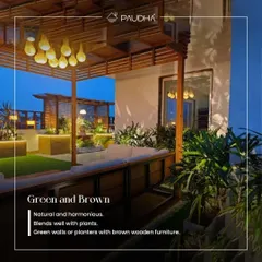 The color combination of green and brown is always natural and harmonious. This rooftop terrace design features green walls and planters that blend beautifully with brown wooden furniture and a pergola, creating a warm, earthy feel.