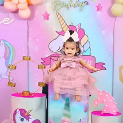 The birthday girl looking absolutely magical in her unicorn-themed party dress. We focus on capturing your child enjoying their special day.