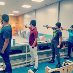 Shooters of different ages try their hand at 10-meter air pistol shooting. This discipline requires immense focus and a steady hand, and our coaches are there to guide you.
