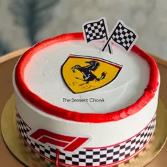 For the Formula 1 enthusiast, this Ferrari-themed cake is a guaranteed winner. It features the iconic shield, checkered flags, and F1 branding, all on a delicious chocolate truffle cake.