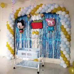 This photo shows the full view of the Mickey and Peppa Pig themed naming ceremony decoration. The colorful balloons and familiar characters make the event fun for the whole family.