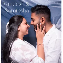 A sweet and intimate portrait from a pre-wedding or engagement shoot. The close-up shot focuses entirely on the couple's happy expressions and loving gaze, capturing a perfect moment of connection.