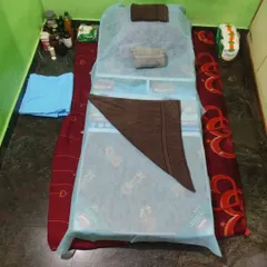This is my professional setup for every home visit. I bring a clean, comfortable massage bed, fresh linens, and all necessary oils so you can have a complete spa experience at home.