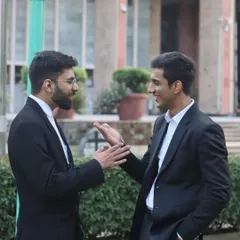 Discussing a potential out of court settlement with a colleague. Sometimes the best solution for a family dispute is found through mediation and compromise, not a lengthy court battle.