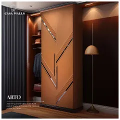 We believe storage should be a statement. For this 'Arto' wardrobe, we used leather fluted paneling with inlaid metal accents to turn a functional piece into a striking design element, enhancing the texture and feel of the surface.