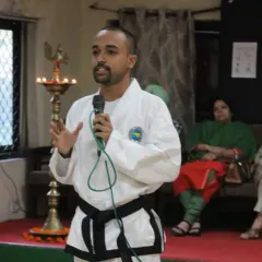 Explaining the principles behind a technique. It's not just about the physical movement, but understanding the 'why' so you can adapt it to real-world situations. This was during a workshop at Sri Aurobindo College.