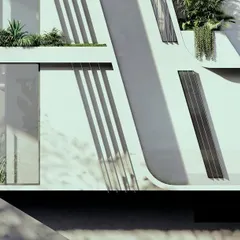A detail of the inclined facade of our Moira Homes project. The angled reveals are not just a stylistic choice; they are designed to hold inbuilt planters, extending the landscape vertically and integrating greenery into the building's form.