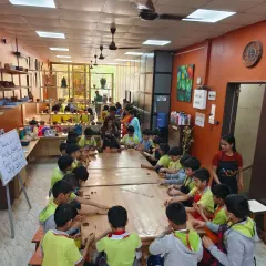 A full classroom of young students from Gopal's Garden School, deeply engaged in a hand-building session. Our studio is equipped to host school groups and private events, offering a fun, educational, and hands-on artistic experience.
