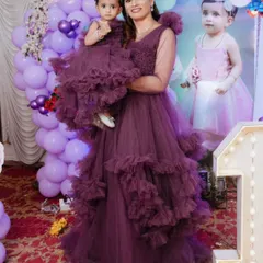 This mother-daughter combo in a rich mauve ruffle gown is one of my favorites. I can create brand new outfits like this for you to rent, so you get a fresh piece for your special event.