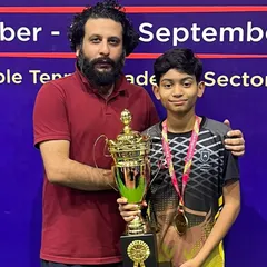 Celebrating another one of our champions holding his trophy at the state championship. Each win is a result of a personalized training plan and the player's dedication to the sport.