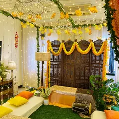 Another look at this beautiful Dholki night decor. The combination of artificial grass, low seating, and sparkling chandeliers transformed the room completely.