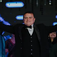 The father of the bride enjoying his moment in the spotlight. We make sure parents feel celebrated and have a great time.