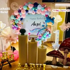 Another angle of Aarvi's mermaid party, this time showing the whimsical mushroom props and additional lighting that add to the magical atmosphere.