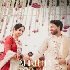 The couple shares a happy, candid moment during their wedding ceremony. We focus on capturing the genuine smiles and interactions that tell your love story.