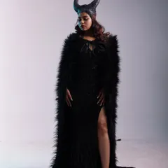 A full-length shot of the dramatic Maleficent costume, showcasing the feathered black cape with a high slit and the iconic horns, perfect for a powerful fantasy look.