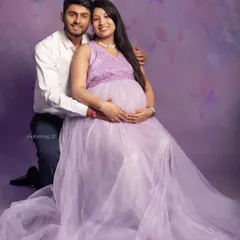 A lovely couple's portrait featuring our popular lavender tulle gown. The soft, romantic color and flowing fabric create a fairy-tale feel, perfectly capturing their shared joy.