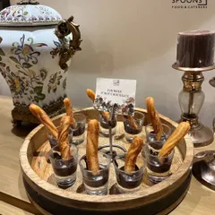 Our signature Churros served with a rich hot chocolate dip. This dessert is presented on a rustic wooden tray, adding a touch of elegance to your event's sweet course.