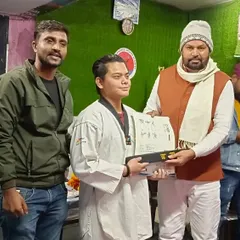 Awarding a certificate to my student for his achievement in the National Hapkido Championship.