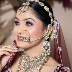 This student created a stunning maroon bridal look, focusing on soft, blended eyeshadow and perfectly defined features. The professional photo you get helps build a strong portfolio.