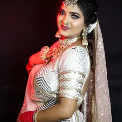A full bridal look in a stunning white and gold lehenga, demonstrating our expertise in creating a cohesive and elegant style from head to toe.