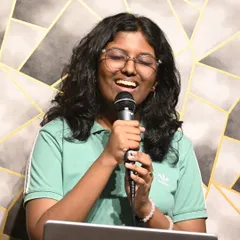 A student lost in her performance, singing with passion and expression. Our goal is to nurture confident performers.