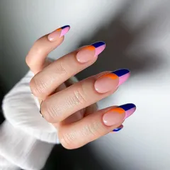 Bold and graphic, this color-blocked French manicure uses sharp blocks of navy blue, hot pink, and vibrant orange. This design is a modern and eye-catching way to wear multiple colors.