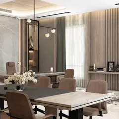 A modern office space that combines a formal meeting area with a comfortable lounge, using natural wood tones and soft lighting to create a welcoming atmosphere.