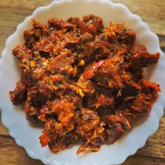 Here’s a close-up of my buff chunks spicy pickle. I use tender pieces of buff and a blend of homemade spices to create this rich and hearty pickle. I can also customize the spice level for you.