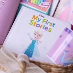 A Disney 'My First Stories' book and a set of colorful pastels, perfect for sparking creativity in a child's birthday hamper.