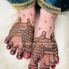 My peacock fever really shows in this intricate foot mehendi. I focused on creating dense, detailed feathers that cover the feet elegantly, making it perfect for a bride or any grand celebration.