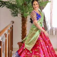 The pure joy of wearing an outfit made just for you. This client is radiant in her colorful and playful lehenga at a family function.