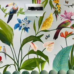 This shot shows more of the intricate details in the tropical mural, from the delicate butterflies to the different types of birds nestled among the leaves. It's a piece that invites you to keep discovering new things.