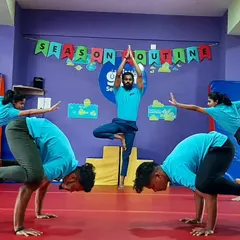 Our instructors are not just coaches; they are role models of strength and balance. Here they are demonstrating various yoga poses, showcasing their impressive skills.