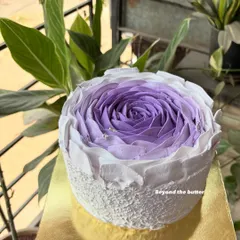 Another view of my signature buttercream flower cake, held up to catch the natural light. The texture and color gradient are what make this design so special.