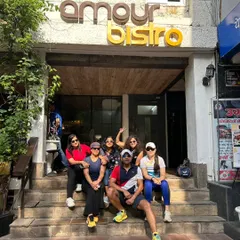 The whole team posing on the steps of Amour Bistro after a birthday run. We earned our treats, and we enjoyed them together as a family.