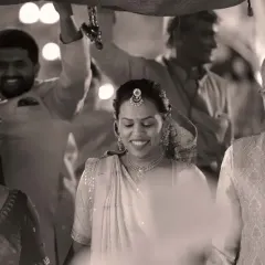 A timeless black and white shot of the bride's entrance. This classic style emphasizes the emotion and significance of the moment, creating a photograph that will never go out of style.