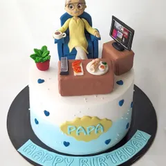 A cake for Papa's 80th birthday. The design features a custom figurine of him relaxing in his chair, watching TV with his favorite snacks.