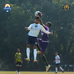 An aerial challenge between our attacker and the opposition goalkeeper. We fight for every ball, whether it's on the ground or in the air.