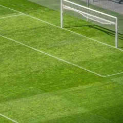 This high-angle view displays the scale and precision of our work. We ensure every line and boundary is perfectly marked, creating a professional football court that meets sporting standards.