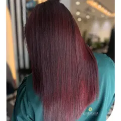 Another look at this stunning red hair color, showing its rich dimension and flawless application from root to tip.