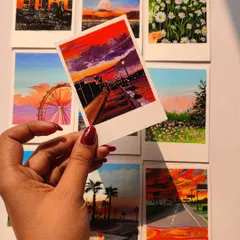 I also offer custom-painted polaroids. This is a collection of various landscape and sunset scenes I've painted in a polaroid format. They make for beautiful, tiny pieces of art to decorate your space.