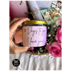 This personalized candle, labeled '30 Days to go! I love you', adds a romantic and personal touch to a countdown hamper.