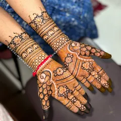 A beautiful baby shower henna design with Indian flair. This piece features traditional peacock motifs on the palms and cute mini elephant bands on the wrists to welcome the little one.