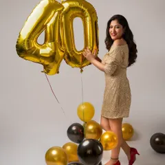 A playful and happy shot from the same 40th birthday session. The gold sequin dress and bright smile perfectly capture the celebratory spirit of the day.