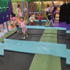 Bouncing high in our trampoline park. It's a great way for kids to burn off energy in a safe, netted environment.