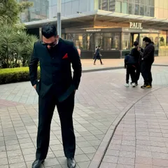 A candid shot in a modern urban setting in Gurugram. For me, a classic black suit is more than just clothing; it's a statement of purpose and resolve.