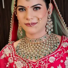 A direct look at this beautiful bride. The mint-green Polki necklace and matching earrings are a perfect example of using color to elevate a bridal look.