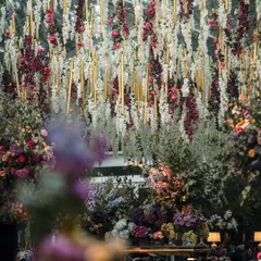 For a Bridgerton-themed Sangeet, we designed this breathtaking floral ceiling. Thousands of wisteria and roses hung overhead, creating a romantic, immersive atmosphere that transported guests to another era.