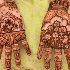 A special Diwali mehendi for a mother-daughter duo. The designs feature beautiful lotus motifs, a symbol of purity and beauty, perfect for the festival of lights.