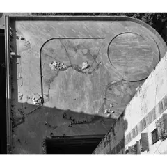 An aerial view during the early construction phase of a large-scale podium project. This perspective shows the foundational layout of the pathways and a central circular feature taking shape, demonstrating how our detailed site-responsive planning translates to the ground.